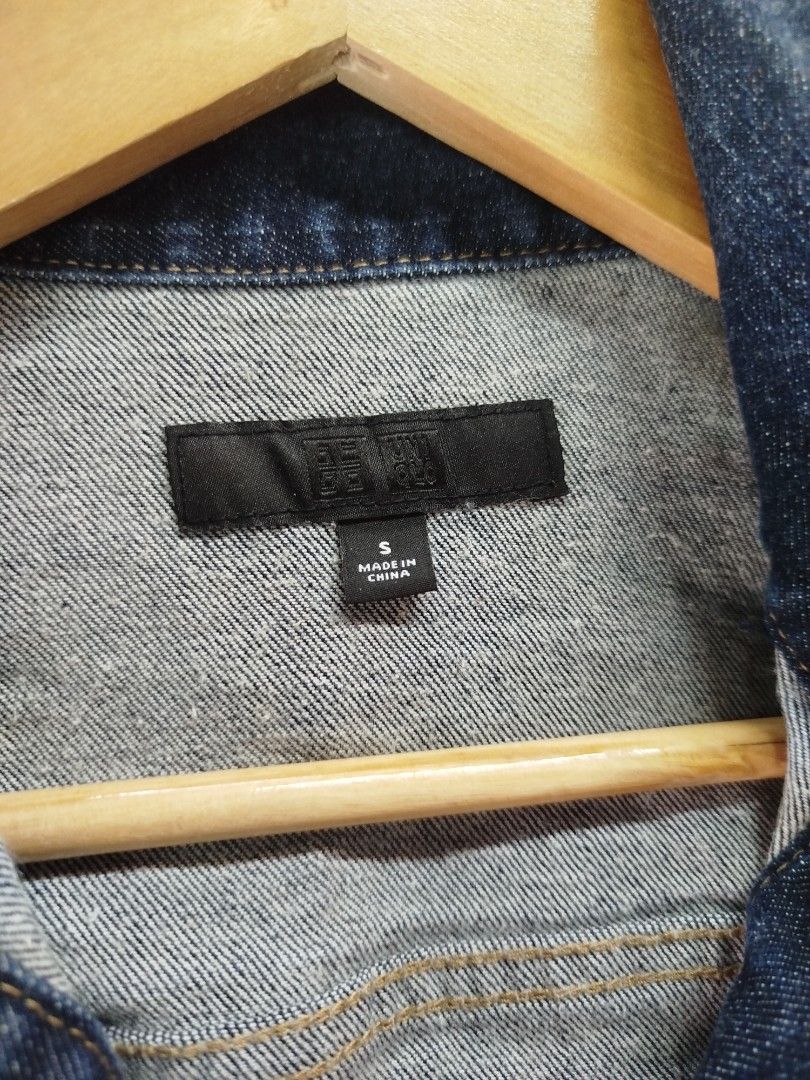 Uniqlo Dark Blue Denim Jacket Size S (Category: Coats, Jackets and Outerwear) located in Quezon City. Submitted by epoquebyjaz (Listing ID 1470639172, Image 3). Description: - Brand: Uniqlo - Size: S - Color: Dark blue / indigo wash - Material: Heavy cotton denim - Features: Classic button-up front, metallic buttons, two chest flap pockets, and vertical front panel stitching - Condition: Brand new with tag attached on sleeve cuff.