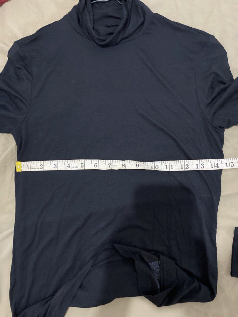 Uniqlo Heattech Black Turtleneck Size M (Category: Longsleeves) located in Quezon City. Submitted by pinkylivar (Listing ID 1470604082, Image 3). Description: - Brand: Uniqlo Heattech - Style: Black long-sleeve turtleneck top - Size: Medium (Bust: 80-86cm / Pit-to-pit: ~15 inches) - Material: 45% acrylic, 28% modal, 7% spandex - Origin: Made in China - Condition/Use: Great essential base layer for cold weather.