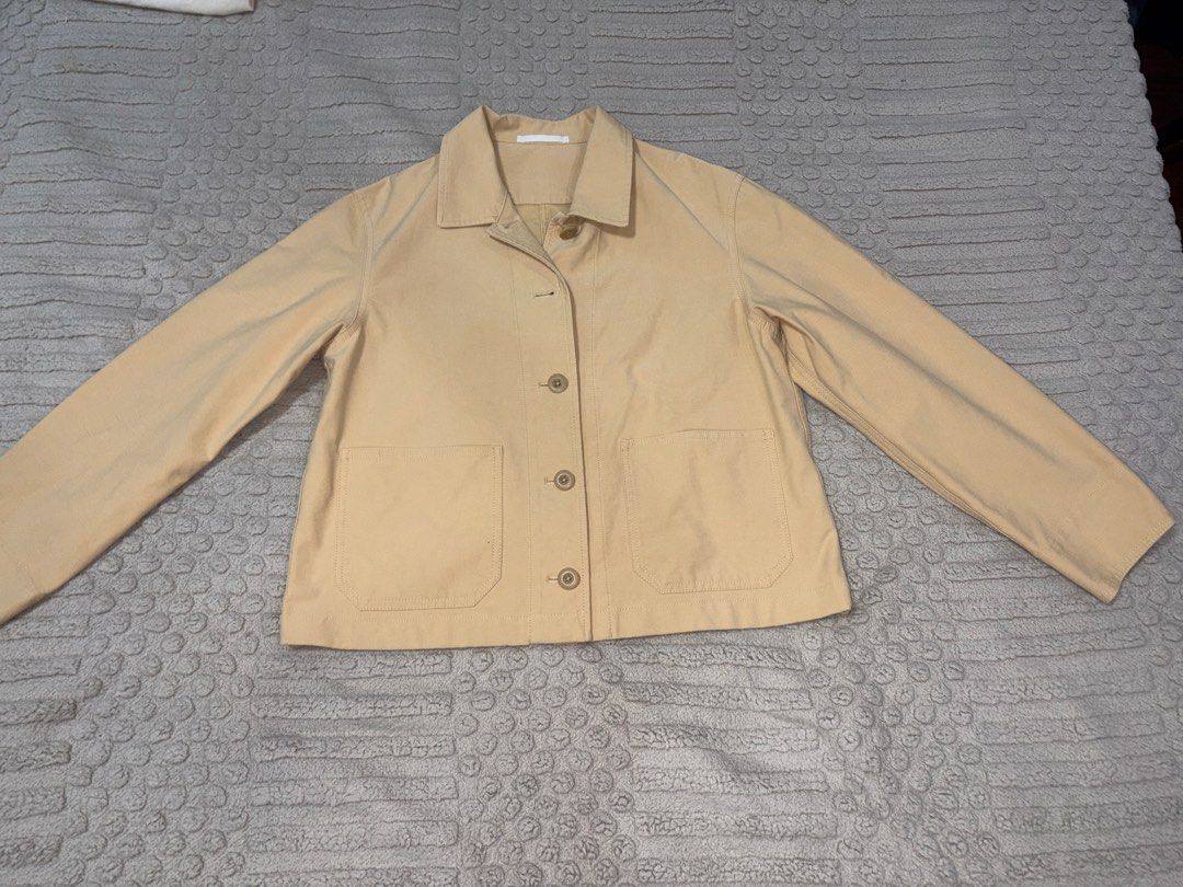 Uniqlo Jacket (Category: Coats, Jackets and Outerwear) located in Marilao. Submitted by luckystone_0cdaee (Listing ID 1470733240, Image 3). Description: Uniqlo Womens Jersey Short Jacket • Material: Knit-look jersey fabric made of 58% polyester, 36% cotton (with stretch for comfort). • Design: Cropped length, collared button-front closure, and dual lower patch pockets. •Size: Medium •Condition: Like new.