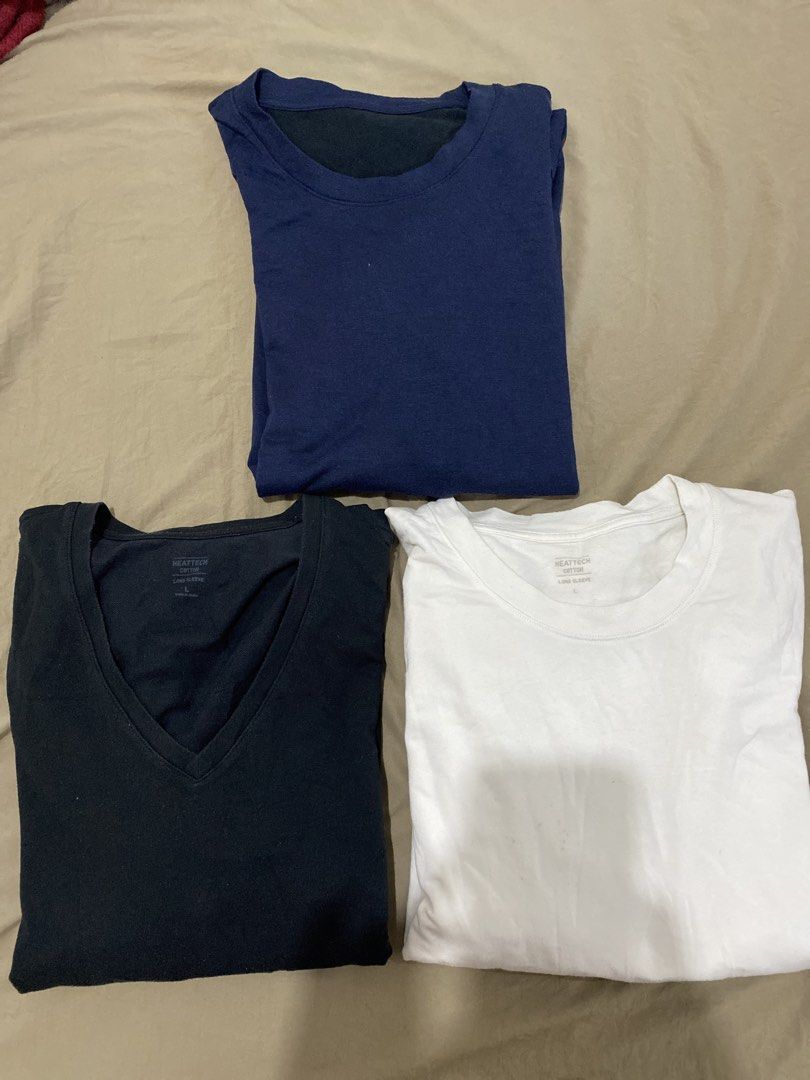 UNIQLO MEN LARGE EXTRA WARM HEATTECH BUNDLE (Category: Tshirts & Polo Shirts ) located in Quezon City. Submitted by pinkylivar (Listing ID 1470602244, Image 1). Description: Size - Large Color- black, white, blue Issue- sign of usage konting himulmol, stain sa white but in very good condition p din po Take all for 500php.
