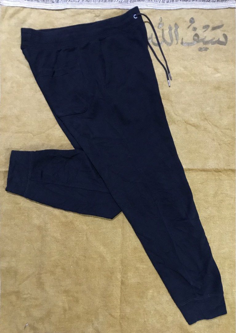 Uniqlo Navy Sweatpants Joggers Drawstring (Category: Joggers) located in Mati. Submitted by abu_razmey (Listing ID 1470729481, Image 1). Description: - Brand/Model: Uniqlo Navy Sweatpants - Size: 80-70 - Material: Comfortable cotton blend (fabric tags attached) - Features: Elastic waistband with matching drawstring, two side pockets, one back pocket, and ribbed ankle cuffs - Condition: Great for daily wear and lounging - Origin: Made in China.