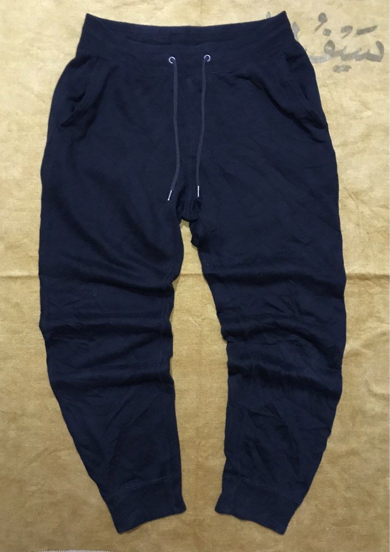 Uniqlo Navy Sweatpants Joggers Drawstring (Category: Joggers) located in Mati. Submitted by abu_razmey (Listing ID 1470729481, Image 2). Description: - Brand/Model: Uniqlo Navy Sweatpants - Size: 80-70 - Material: Comfortable cotton blend (fabric tags attached) - Features: Elastic waistband with matching drawstring, two side pockets, one back pocket, and ribbed ankle cuffs - Condition: Great for daily wear and lounging - Origin: Made in China.