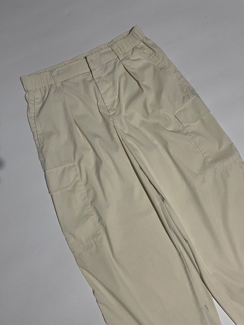 Uniqlo parachute cargo pants (Category: Trousers) located in Bais. Submitted by christian.complexthrift08 (Listing ID 1470649739, Image 3). Description: Uniqlo parachute cargo pants (Perfect for daily use) Color: off white Size: 30 to 32 on tape Length: 39 inches Thigh: 14 inches Leg opening: 9.7 inches Condition: 9 / 10 Issue: blue stain Price: 399 free shipping Meet up or via JNT express.