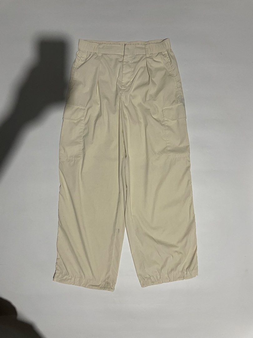 Uniqlo parachute cargo pants (Category: Trousers) located in Bais. Submitted by christian.complexthrift08 (Listing ID 1470649739, Image 1). Description: Uniqlo parachute cargo pants (Perfect for daily use) Color: off white Size: 30 to 32 on tape Length: 39 inches Thigh: 14 inches Leg opening: 9.7 inches Condition: 9 / 10 Issue: blue stain Price: 399 free shipping Meet up or via JNT express.