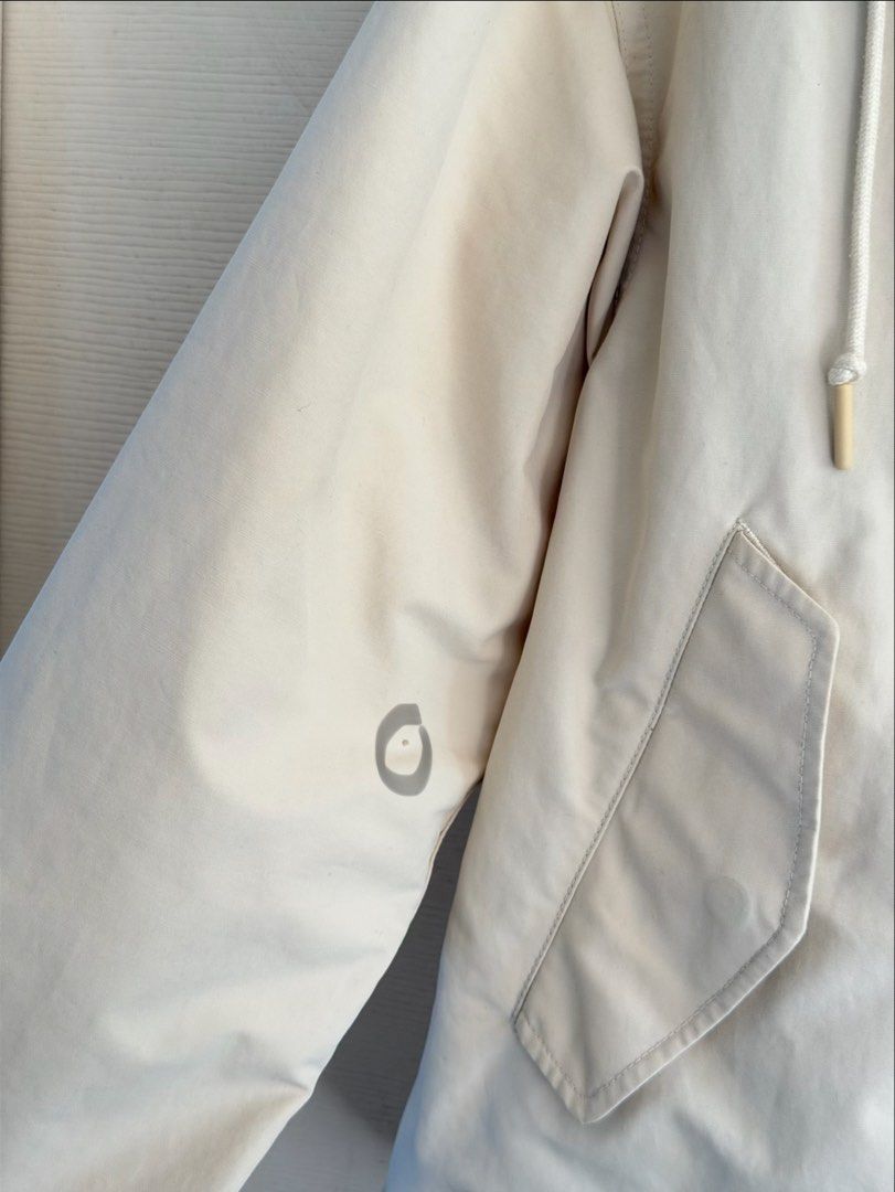 Uniqlo Parka Jacket Beige Size Small (Category: Coats, Jackets and Outerwear) located in Manila. Submitted by cinnmoroll (Listing ID 1470597074, Image 3). Description: - Brand: Uniqlo - Item: Lightweight Parka Jacket - Color: Beige / Cream - Size: Small - Condition: Still very wearable, but has minor flaws (paint chip on one button and small, minimal stains on the sleeves) - Note: Please check the close-up photos for the exact condition of the fl