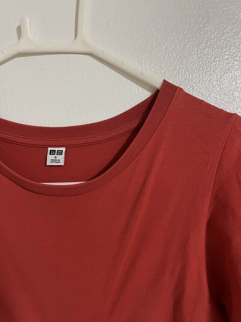 Uniqlo Red Flutter Sleeve Tee (Category: Shirts) located in Cabuyao City. Submitted by rdtrmt (Listing ID 1470576808, Image 2). Description: - Brand: Uniqlo - Color: Red - Size: S - Material: Soft cotton blend (Made in Vietnam) - Design: Short flutter sleeves and classic crew neckline - Style Tip: Great basic piece to match with high-waisted jeans or skirts - Condition: still in good condition .