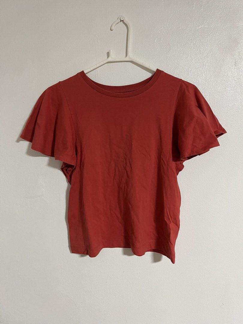 Uniqlo Red Flutter Sleeve Tee (Category: Shirts) located in Cabuyao City. Submitted by rdtrmt (Listing ID 1470576808, Image 1). Description: - Brand: Uniqlo - Color: Red - Size: S - Material: Soft cotton blend (Made in Vietnam) - Design: Short flutter sleeves and classic crew neckline - Style Tip: Great basic piece to match with high-waisted jeans or skirts - Condition: still in good condition .