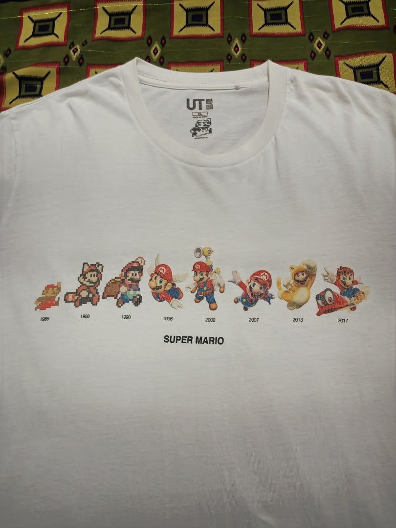 Uniqlo Super Mario White Tee (Category: Tshirts & Polo Shirts ) located in Lapu Lapu. Submitted by rebuild.arkives (Listing ID 1470622091, Image 2). Description: Uniqlo Super Mario White Tee ‎ ‎📏 Size Guide (Inches): ‎Length: 31 ‎Width: 22 ‎ ‎Color: 10/10 ‎Condition: 10/10 ‎Issue: None ‎ ‎📝 Heads up: ‎• This is a thrift item so please manage your expectations. ‎• Color may slightly differ due to lighting. ‎• Washed and ready to wear. ‎• Shippin