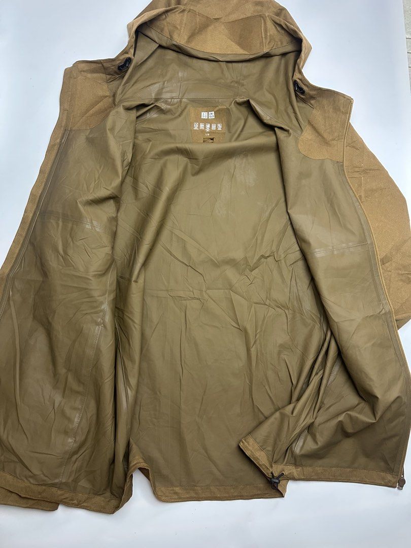 Uniqlo waterproof jacket (Category: Coats, Jackets and Outerwear) located in Orani. Submitted by ajgav69 (Listing ID 1470600409, Image 2). Description: Uniqlo water proof jacket brown Size large As new condition 24width 29 length Complete with wahstag inside pocket Adjustablepuller no issue .
