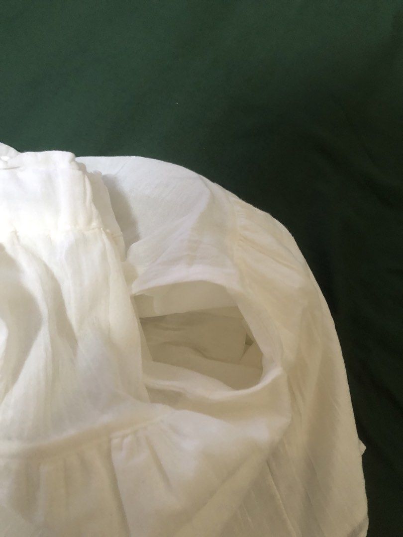 Uniqlo White Tiered Skort (Category: Skirts) located in Cavite. Submitted by sell.kya (Listing ID 1470645887, Image 3). Description: - bought in kids section - best fit 25-26 waistline - with side pockets.