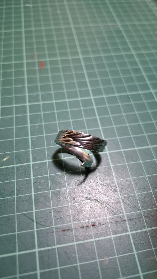 Upcycled Stainless Steel Feather Wrap Ring (Category: Rings) located in Valenzuela. Submitted by kneeko (Listing ID 1470665993, Image 1). Description: RINGS MADE FROM CUTLERY/KUBYERTOS Size (Inner Diameter) : approx. 24mm DIY rings from various types of cutlery sourced from ukays and surplus shops. Quality can vary, but will indicate flaws. Material is stainless steel. LAST PRICE POSTED! Colors of the item are not accurate to the photo due to lig