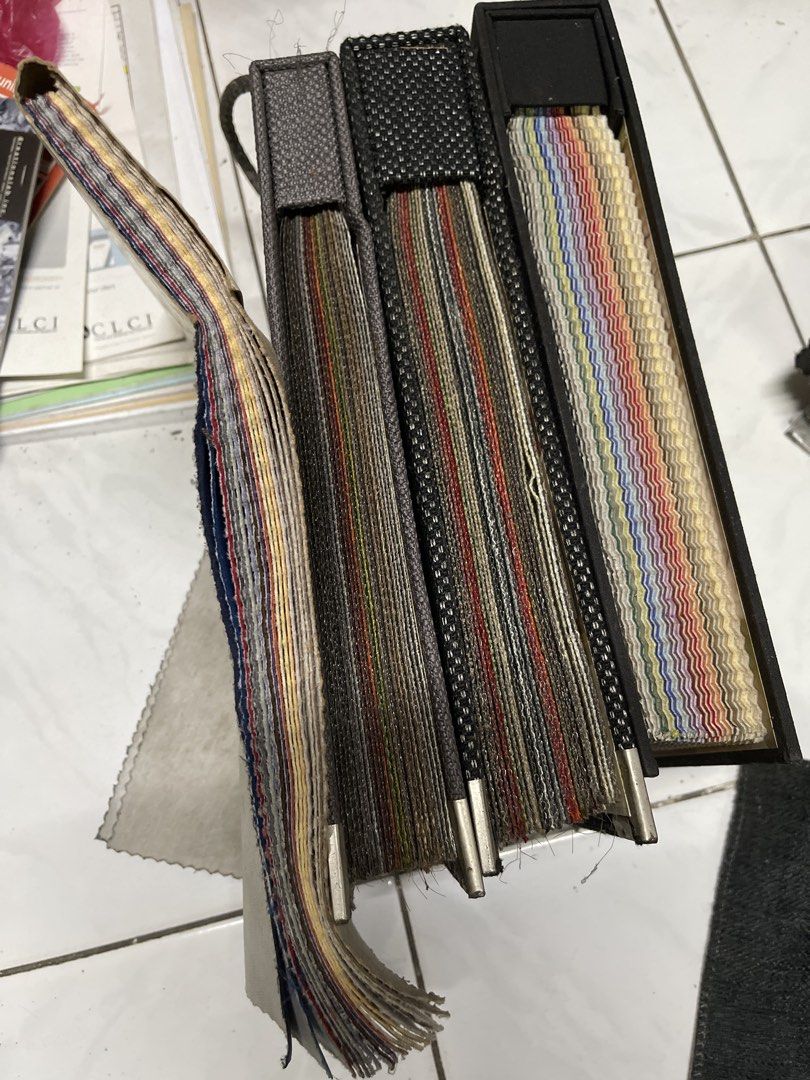 Upholstery Fabric Swatch Book Sample Set (Category: Stationery & School Supplies) located in Pasay City. Submitted by theclutterfree (Listing ID 1470632093, Image 1). Description: TAKE ALL Fabric swatch book with multiple sample textures and colors - Includes woven white, grey suede, bronze patterned weave, mustard yellow, and cream fabrics - Design: F00374 - Composition: 100% polyester .