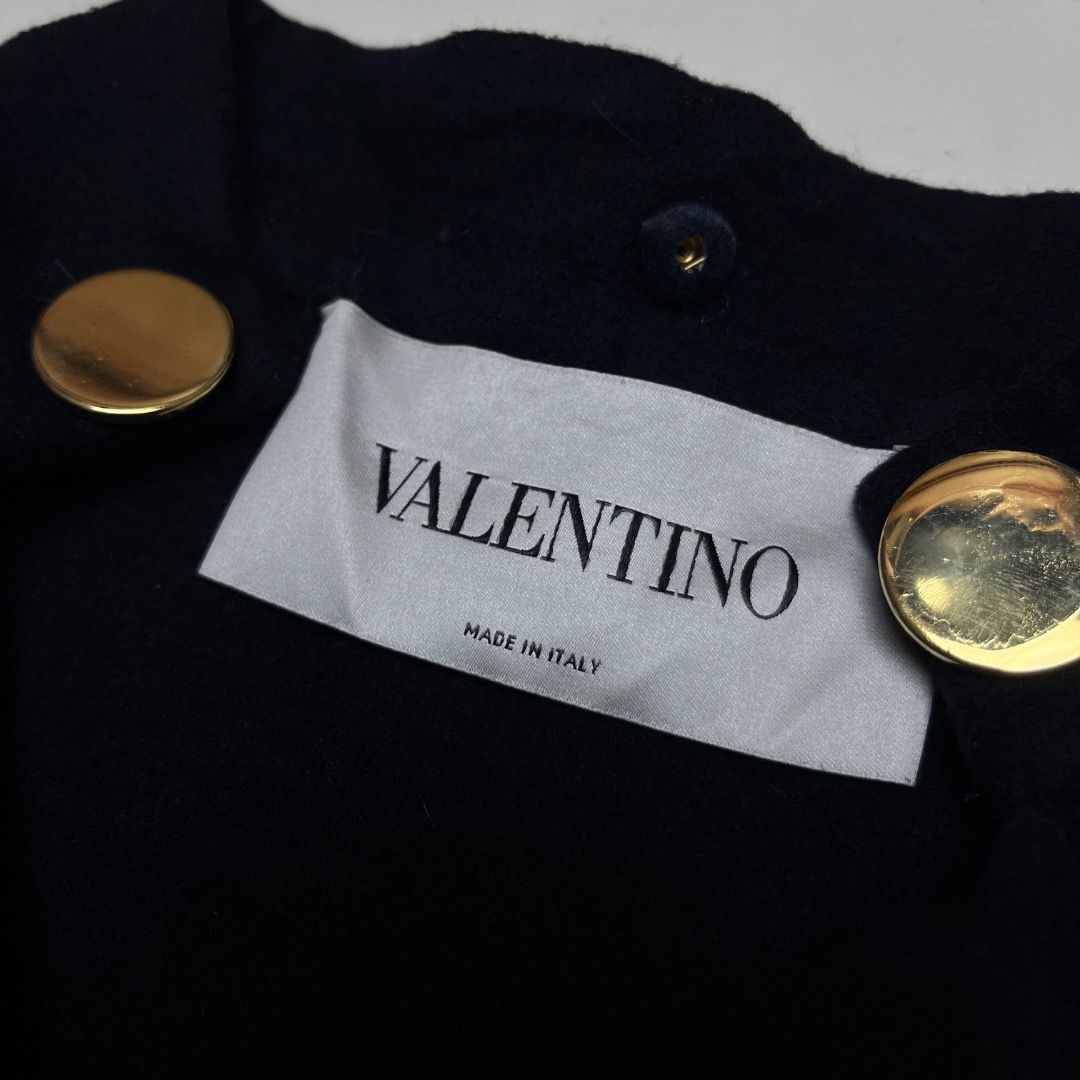 Valentino Navy Double-Breasted Wool Cashmere Jacket (Category: Coats, Jackets and Outerwear) located in Caloocan City. Submitted by achilles_grails (Listing ID 1470565832, Image 3). Description: - Brand: Valentino - Style: Double-breasted jacket with high stand collar and folded lapel - Color: Dark navy blue - Material: 90% virgin wool, 10% cashmere (Silk lining) - Origin: Made in Italy - Size: 8 - Details: Gold-tone metal hardware, heavy warm fa