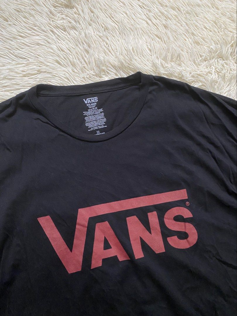 Vans Black T-Shirt with Red Logo (Category: Tshirts & Polo Shirts ) located in Manila. Submitted by switchcity (Listing ID 1470598616, Image 2). Description: - Brand: Vans - Color: Black with large red chest logo - Size: XXL - Material: Soft 100% cotton - Fit: Regular fit with classic crew neck and short sleeves - Condition: Great casual basic piece.
