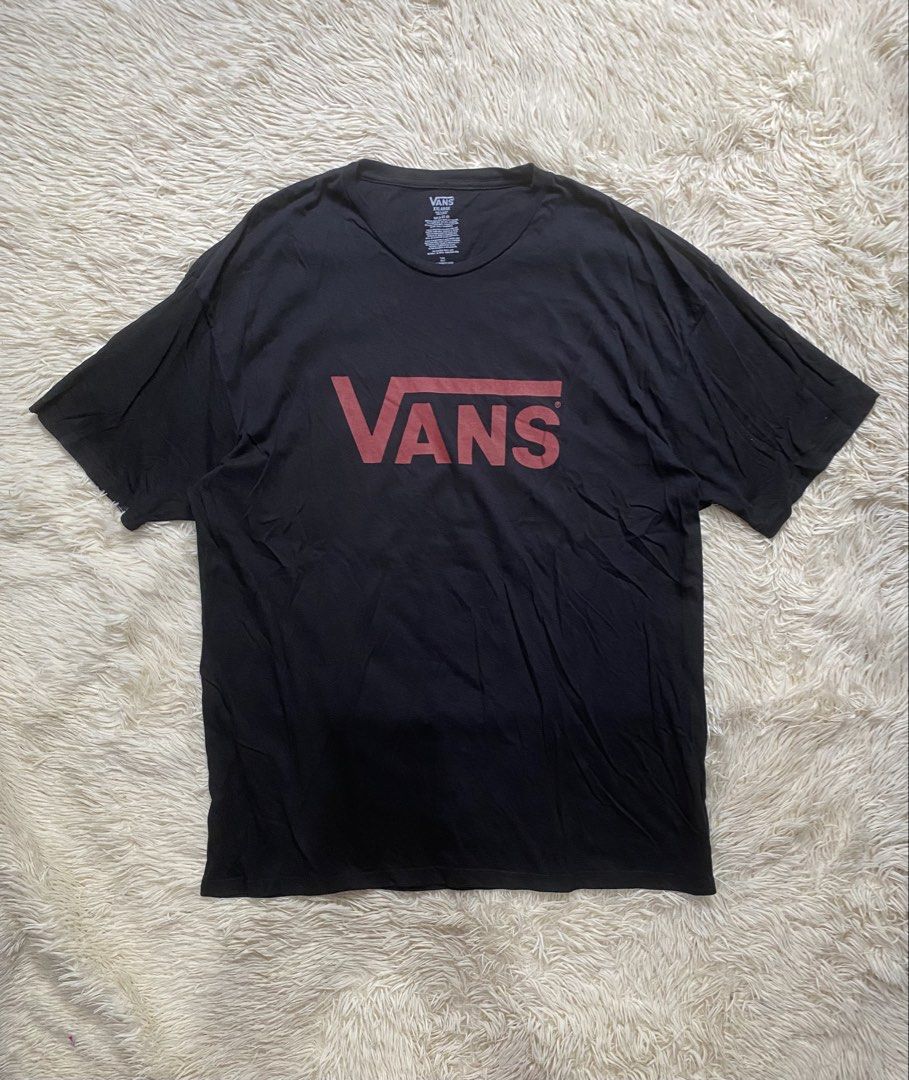 Vans Black T-Shirt with Red Logo (Category: Tshirts & Polo Shirts ) located in Manila. Submitted by switchcity (Listing ID 1470598616, Image 1). Description: - Brand: Vans - Color: Black with large red chest logo - Size: XXL - Material: Soft 100% cotton - Fit: Regular fit with classic crew neck and short sleeves - Condition: Great casual basic piece.