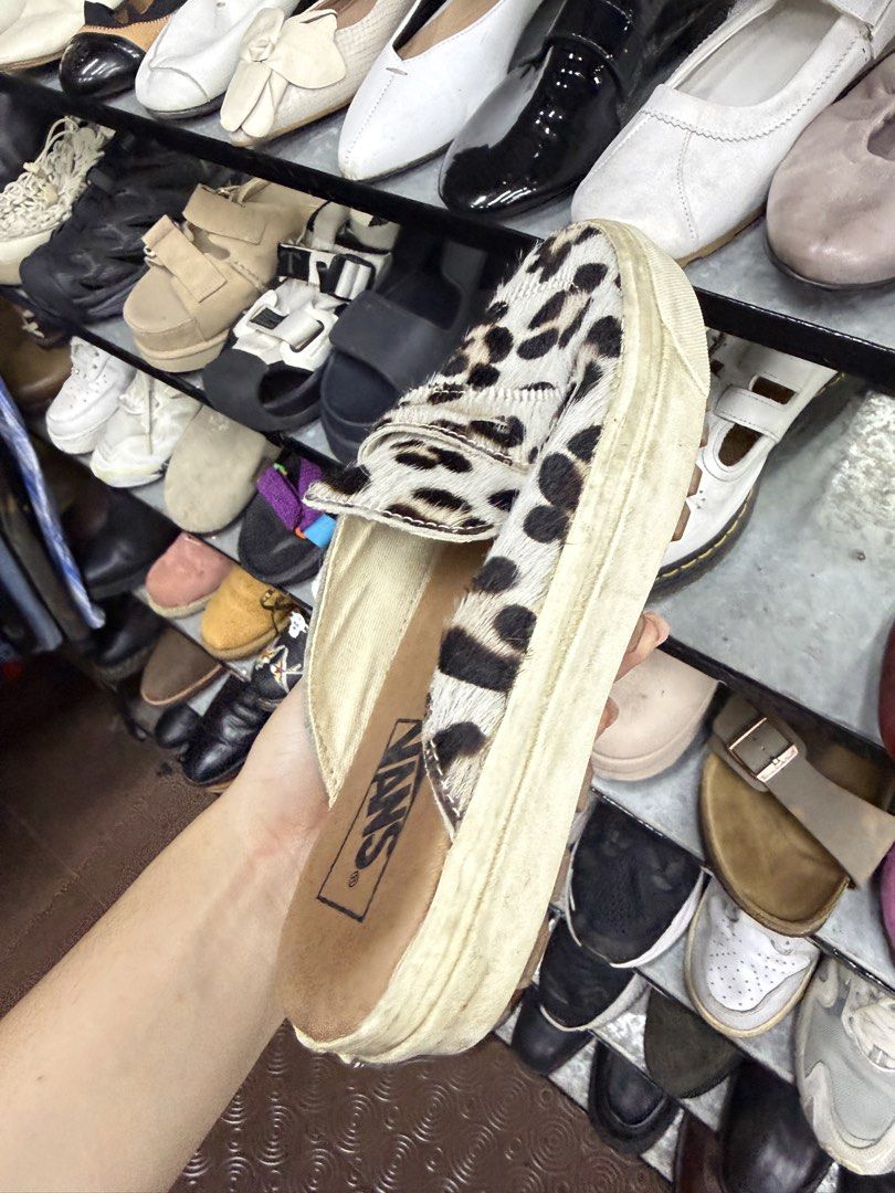 Vans Leopard Print Slip-On Mules (Category: Sneakers) located in Abucay. Submitted by fastlion.584bdf (Listing ID 1470649877, Image 2). Description: - Style: Vans Slip-On Mules - Print/Material: Bold leopard print with genuine calf hair upper - Sole: Chunky textured rubber outsole for better grip - Size: US Women 7.0 / US Men 5.5 / EUR 37.0 - Design: Easy backless slip-on with classic Vans branding.