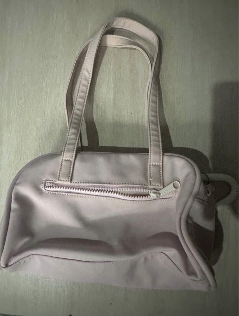 Vanwalk Pink Shoulder Bag with Front Pockets (Category: Shoulder Bags) located in Manila. Submitted by zayzay08 (Listing ID 1470728260, Image 2). Description: - Brand: Vanwalk - Color: Pastel Pink - Handles: Double top handles for easy carrying - Pockets: Two zipped front pockets (one with cute embroidered text) and a full-length rear zipper compartment - Closure: Dual main zipper closure - Interior: Spacious cream fabric lining - Extras: Side ri