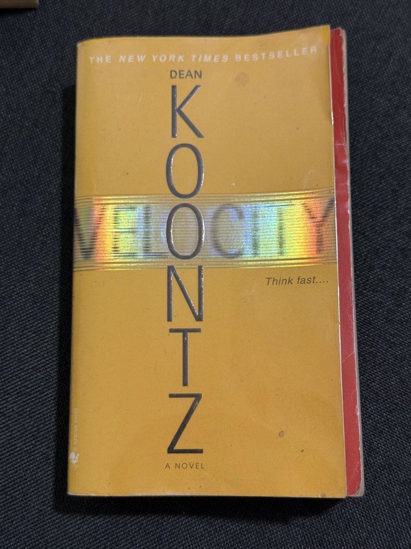 Velocity by Dean Koontz Paperback Novel (Category: Storybooks) located in Batangas. Submitted by ca_decluttering (Listing ID 1470649012, Image 1). Description: - Title & Author: Velocity by Dean Koontz (New York Times Bestseller) - Edition: Bantam Books paperback - Genre: Suspense thriller - Appearance: Iconic yellow cover with holographic title lettering - Condition: Read once, minor shelf wear on edges and spine - Perfect for thrill-seekers and