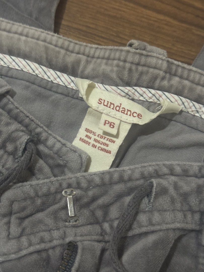 Velvet Cargo Pants (Category: Other Bottoms) located in Pasig City. Submitted by kia.sell (Listing ID 1470630939, Image 3). Description: - Style: Low-to-mid rise cargo pants with paneled stitching - Color: Washed Gray / Slate - Fabric: Soft velvet texture (durable, light-weight fabric) - Design Details: Functional with multi-pocket, adjustable front drawstring tie, front zipper fly with clasp, and zipper slits at the bottom hems adjusts flare of 