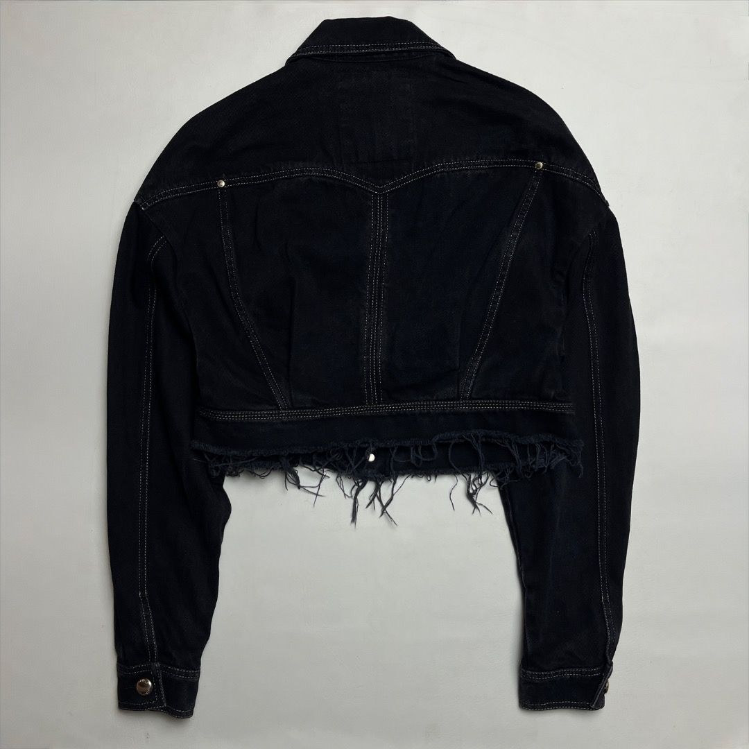 Versace Jeans Couture Black Cropped Denim Jacket (Category: Coats, Jackets and Outerwear) located in Caloocan City. Submitted by achilles_grails (Listing ID 1470583731, Image 2). Description: - Brand: Versace Jeans Couture - Color: Black denim - Fit: Cropped fit with raw frayed hem - Hardware: Gold-tone hardware with engraved metal buttons - Special Details: Decorative gold tips on collar points, contrast topstitching - Pockets: Two chest pockets