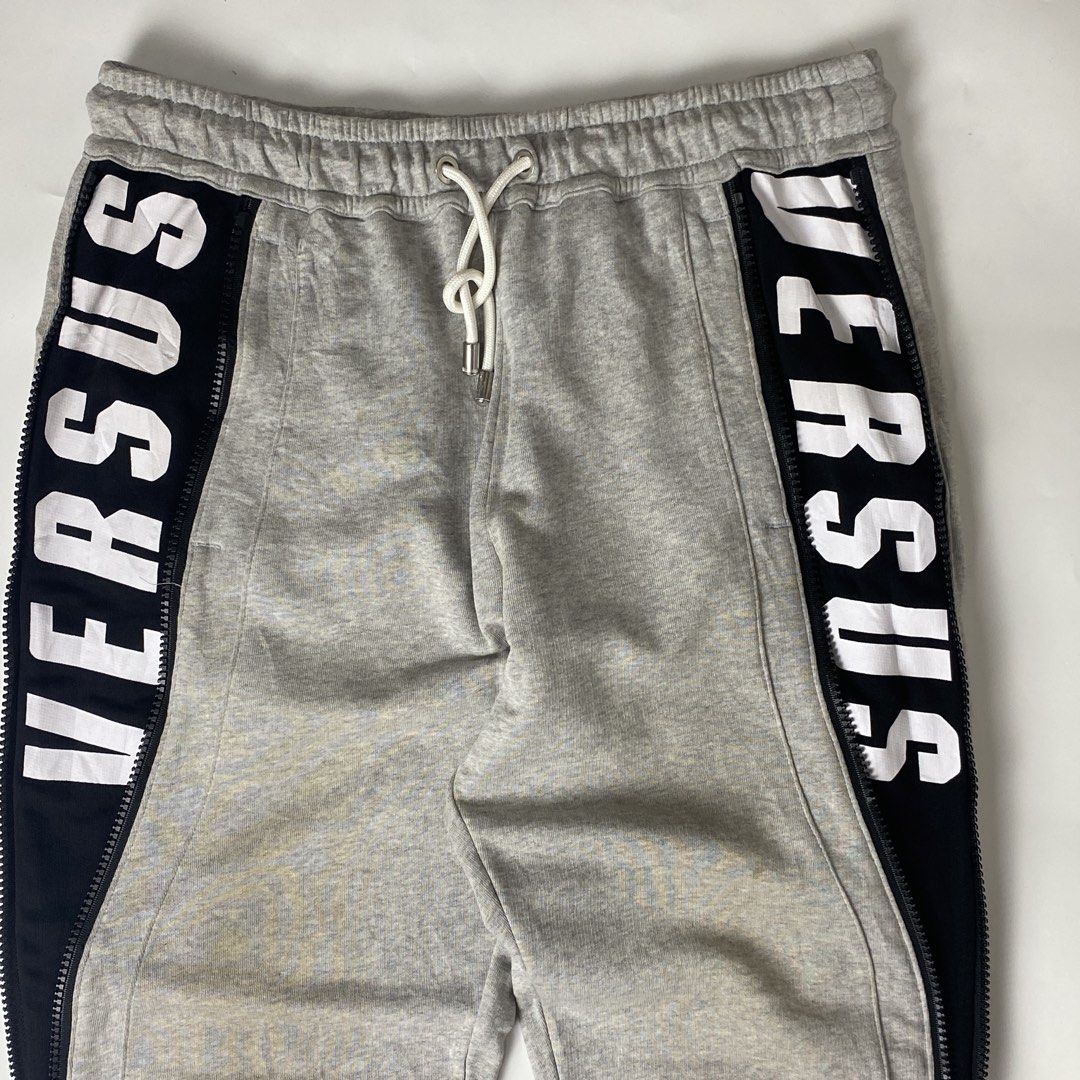 Versus Versace Active Zip Seam Joggers (Category: Joggers) located in Bacolod City. Submitted by rewear.conceptual (Listing ID 1470726135, Image 2). Description: Versus Versace Active Zip Seam Joggers Condition: 9.5/10 Color rate: 9.5/10 Tagged as: large Waist: 32 (garterized) Length: 42 Leg opening: 4 (stretchable cuff) Inseam: 31 Front rise: 13.5 Thigh: 12.5 Knee: 9 Message seller if interested Always double check the items description before m