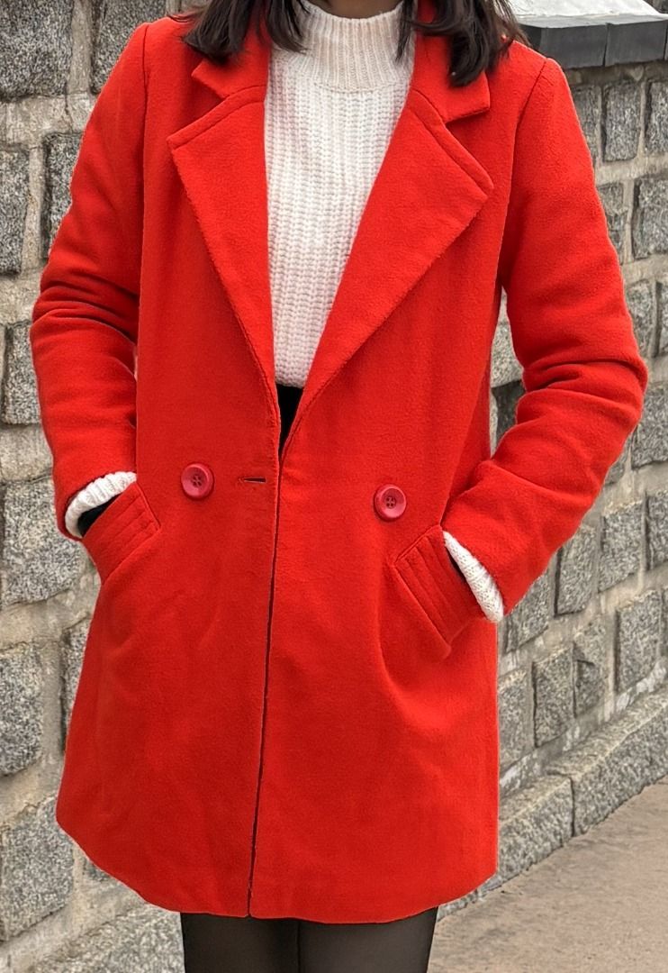 Vibrant Red Wool-Blend Double-Breasted Winter Coat (Category: Coats, Jackets and Outerwear) located in Manila. Submitted by jira____ (Listing ID 1470684089, Image 1). Description: Bright red mid-length winter coat with a classic lapel collar and double-breasted button closure. Features two front pockets with ribbed accents, a structured silhouette falling to mid-thigh, and thick, warm fabric that is easy to layer over sweaters..