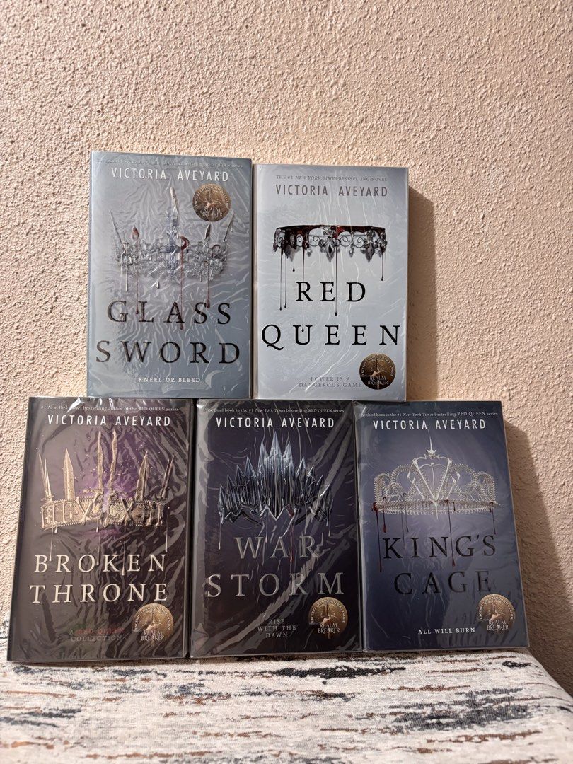 Red Queen by Victoria Aveyard 5-Book COMPLETE Set (Category: Storybooks) located in Caloocan City. Submitted by boldstorm-6421 (Listing ID 1470726037, Image 1). Description: - Complete 5-book series by Victoria Aveyard - Includes Red Queen, Glass Sword, King's Cage, War Storm, and Broken Throne - Paperback format - Perfect YA fantasy series for readers and collectors.