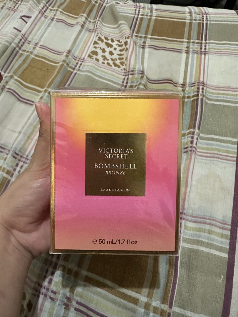 Victoria's Secret Bombshell Bronze Eau de Parfum 50ml (Category: Fragrance & Deodorants) located in Bugallon. Submitted by lavenderlane (Listing ID 1470617260, Image 1). Description: - Authentic Victoria's Secret Bombshell Bronze Eau de Parfum - Size: 50 mL / 1.7 fluid ounces - Condition: Brand new, factory-sealed with plastic wrap - Fragrance Notes: Sun-soaked peony, golden mango, and tanning oil accord - Vibe: Perfect summer scent capturing war
