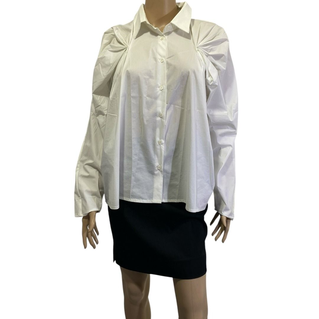 Viktoria Chan White Button Down Poplin Gathered Raglan Shoulders Top (Category: Blouses) located in Cebu City. Submitted by posh_avenue888 (Listing ID 1470677878, Image 2). Description: In very good condition. Size medium. Fabric is cotton blend. 100% authentic or your money back!!! Measurements (estimated-taken flat): Chest: 21 inches; Sleeves: 24 inches; Length: 25 inches. #White(WhiteMix)SilverTopsBlackBox1.