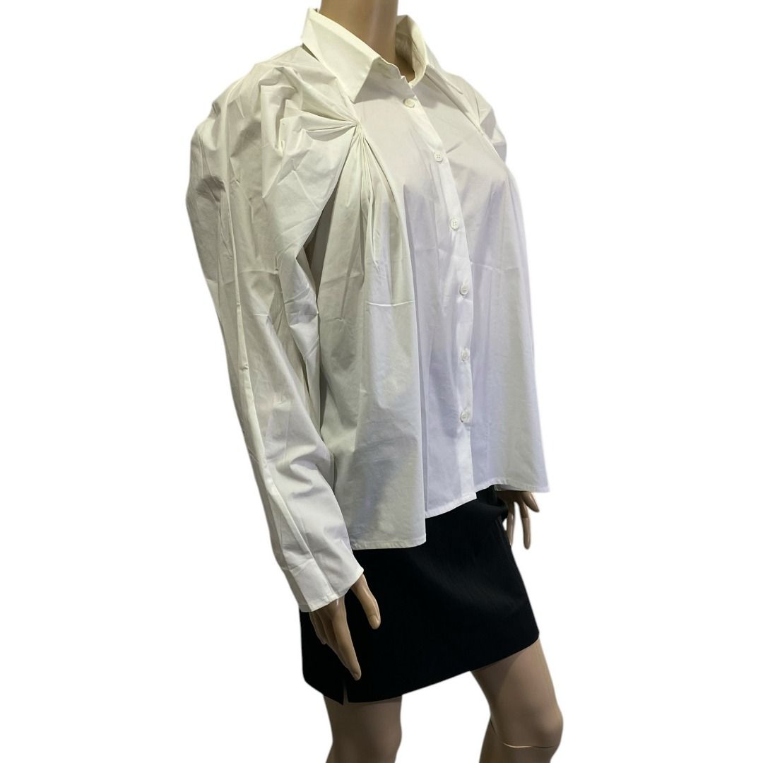 Viktoria Chan White Button Down Poplin Gathered Raglan Shoulders Top (Category: Blouses) located in Cebu City. Submitted by posh_avenue888 (Listing ID 1470677878, Image 3). Description: In very good condition. Size medium. Fabric is cotton blend. 100% authentic or your money back!!! Measurements (estimated-taken flat): Chest: 21 inches; Sleeves: 24 inches; Length: 25 inches. #White(WhiteMix)SilverTopsBlackBox1.