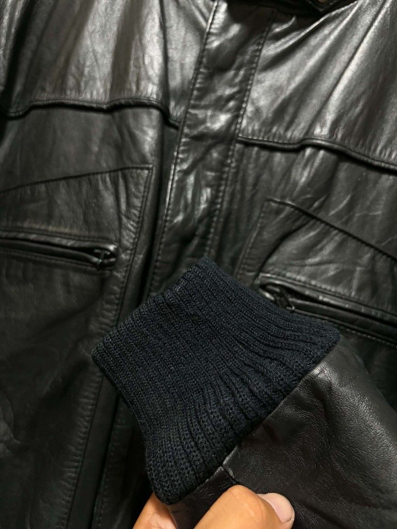Vintage Black Leather Bomber Jacket Stand Collar (Category: Coats, Jackets and Outerwear) located in Quezon City. Submitted by kimzxc_536 (Listing ID 1470726046, Image 3). Description: - Style: Black leather bomber jacket - Fit: Regular fit with paneled leather detailing - Collar: High stand collar with snap button closures - Pockets: Two front chest pockets with secure zippers - Details: Ribbed cuffs and hem with natural grain texture - Material