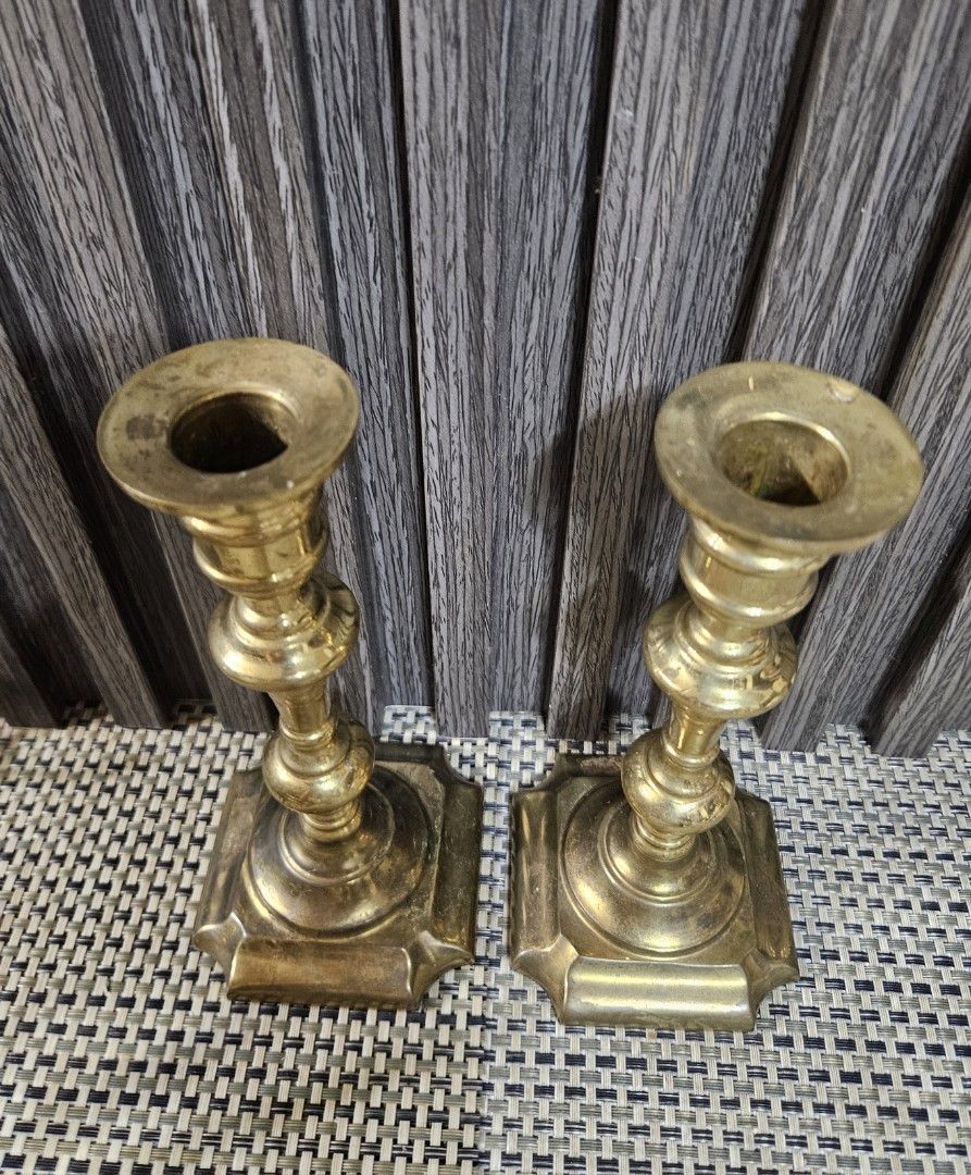 Vintage Brass Candlestick Holders Pair (Category: Vintage Collectibles) located in Rizal. Submitted by cherry_garcia (Listing ID 1470628220, Image 3). Description: - Material: Solid brass with square bases - Height: Approx. 7.5 inches tall - Design: Classic turned design with a satisfying weight - Condition: Clean, with minor patina and slight tarnish from age - Best for: Dinner table settings or mantelpiece decor - Inclusions: Sold as a pair.