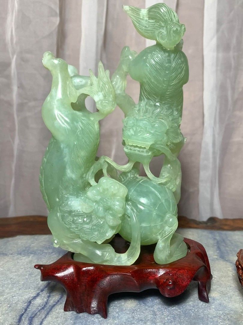 Vintage Chinese Stone Carving (Category: Vintage Collectibles) located in Davao. Submitted by antiquesandvintagestuffsPH (Listing ID 1470621778, Image 2). Description: Chinese Jade Foo Dog Hand carved Stone Statue w Wooden Base - Stunning Chinese carved jade stone statue on a custom wooden base. Beautiful translucent light green color. Features a Qilin (mythical dragon-like creature) playing with a ball. Measurement : 7.25inch height / 4.25inch l