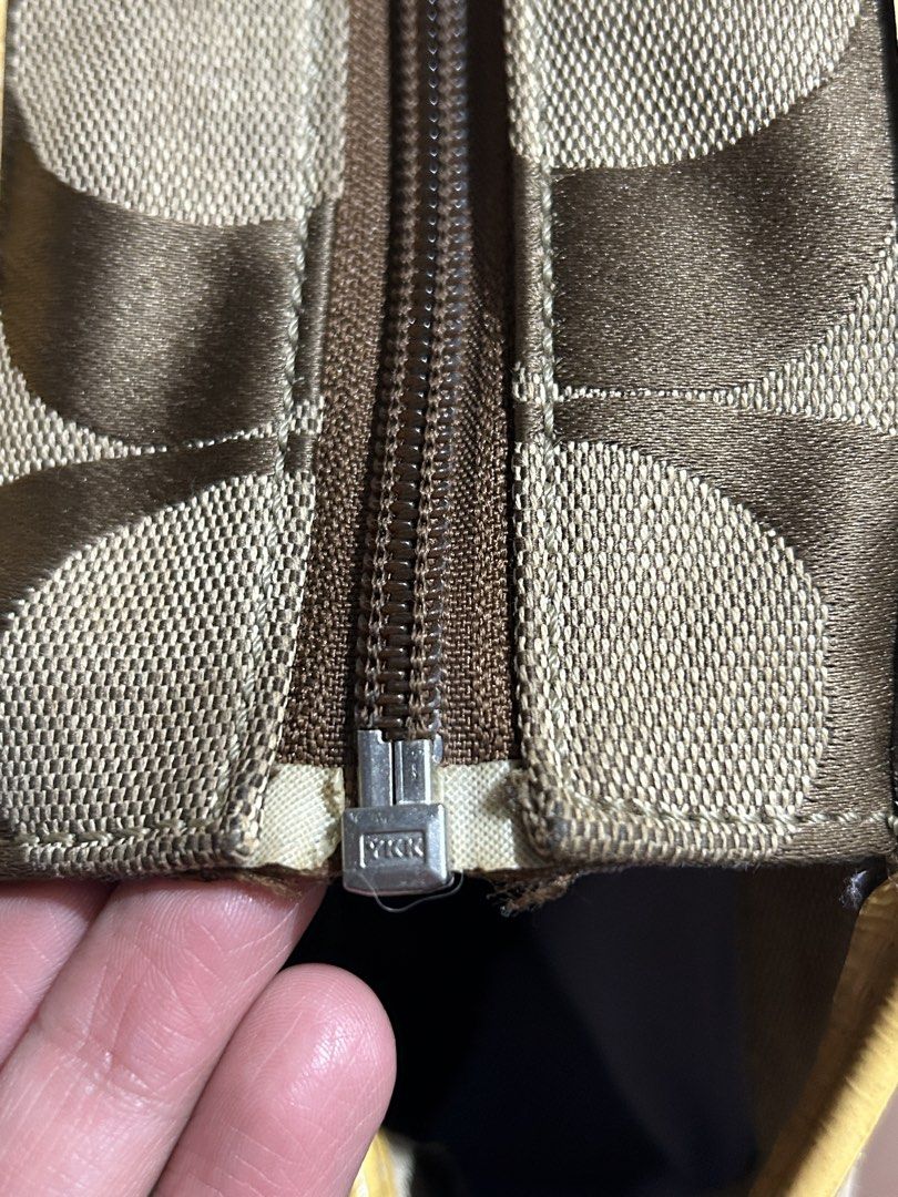 Vintage coach (Category: Luxury Bags & Wallets) located in Santa Rosa. Submitted by feldy.moon (Listing ID 1470558435, Image 3). Description: Vintage Coach Signature Tote Bag 👜🤎💛 Selling my vintage Coach tote bag in brown signature monogram with yellow leather accents. ✨ Details: * Authentic vintage Coach design * Classic brown signature monogram * Yellow leather trim and handles * Front zippered pocket * Spacious interior, perfect for everyda