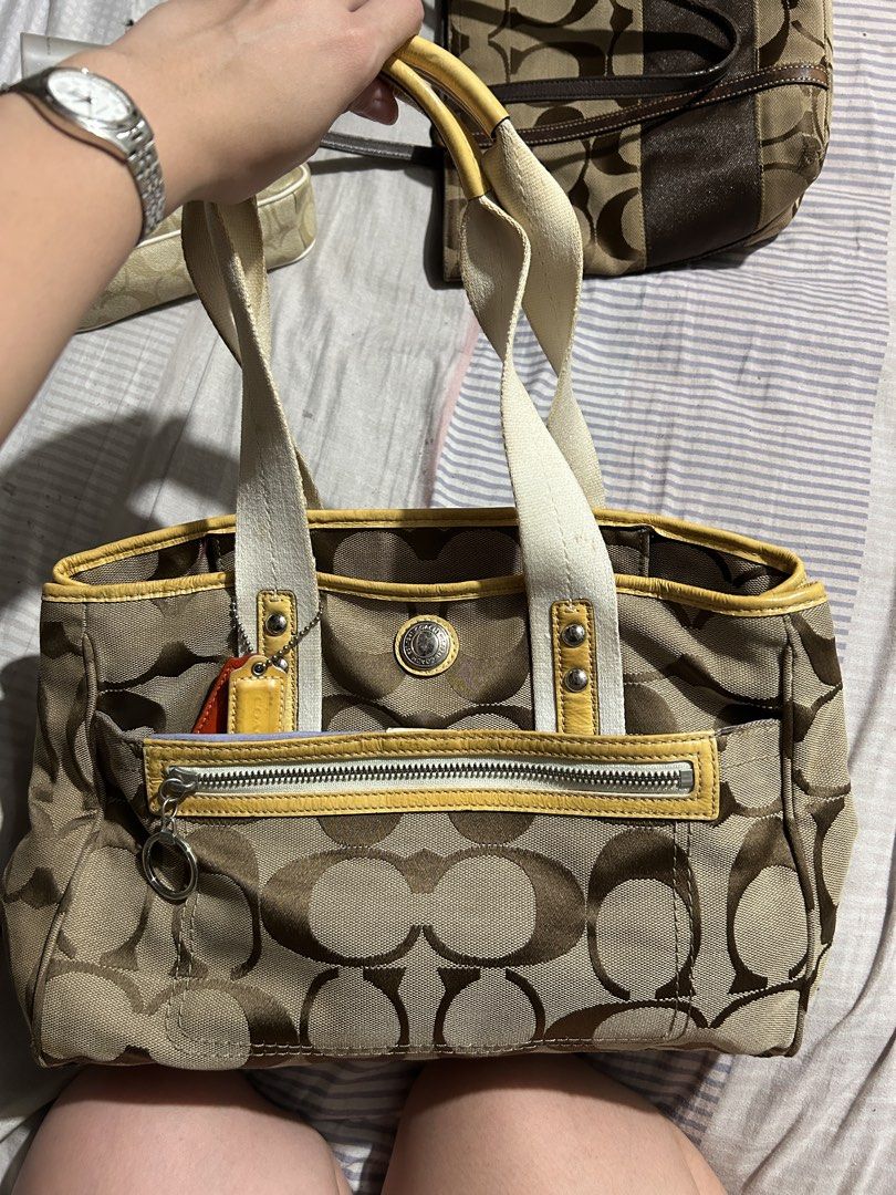 Vintage coach (Category: Luxury Bags & Wallets) located in Santa Rosa. Submitted by feldy.moon (Listing ID 1470558435, Image 1). Description: Vintage Coach Signature Tote Bag 👜🤎💛 Selling my vintage Coach tote bag in brown signature monogram with yellow leather accents. ✨ Details: * Authentic vintage Coach design * Classic brown signature monogram * Yellow leather trim and handles * Front zippered pocket * Spacious interior, perfect for everyda