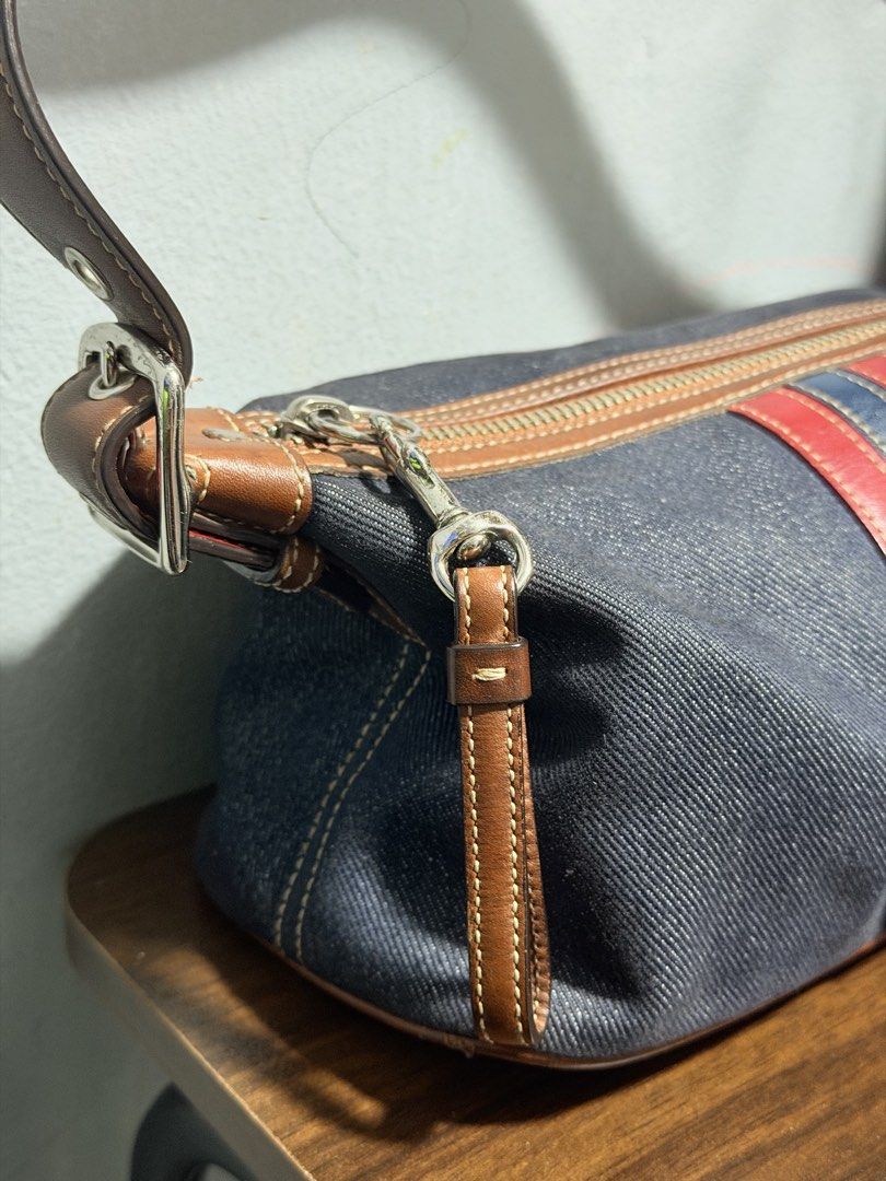 Vintage Coach Mini Bag (Category: Luxury Bags & Wallets) located in Mandaluyong City. Submitted by marsemars (Listing ID 1470663103, Image 3). Description: - Authentic Coach shoulder bag in stylish dark denim fabric - Eye-catching brown and red leather stripes down the front - Secure zip top closure and convenient outer zippered pocket - Adjustable brown leather strap with buckle for a custom fit - Elegant silver-tone hardware and zippers - Inter