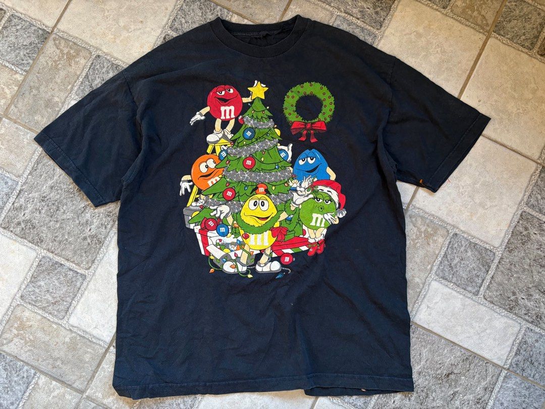 Vintage M&Ms Christmas Tee (Category: Tshirts & Polo Shirts ) located in Manila. Submitted by nofits.garments (Listing ID 1470663198, Image 1). Description: Vintage M&Ms Christmas Tee Large Width 23 Length 30 Cut tag mini loose stitch.