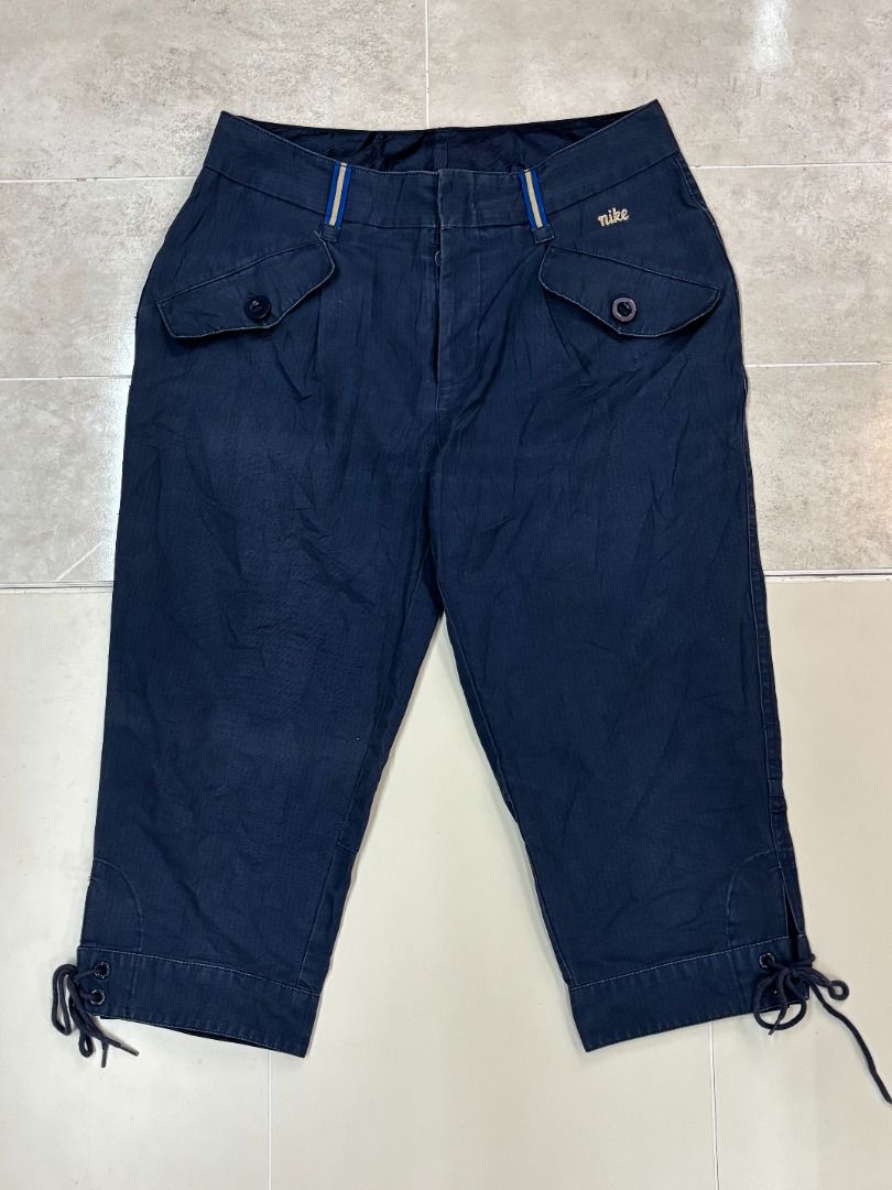 Vintage Nike cropped capri pants (Category: Jeans) located in Manila. Submitted by nlgarments (Listing ID 1470576573, Image 1). Description: classic embroidered script logo, utility button-flap front pockets, and adjustable lace-up details at the cuffs. .