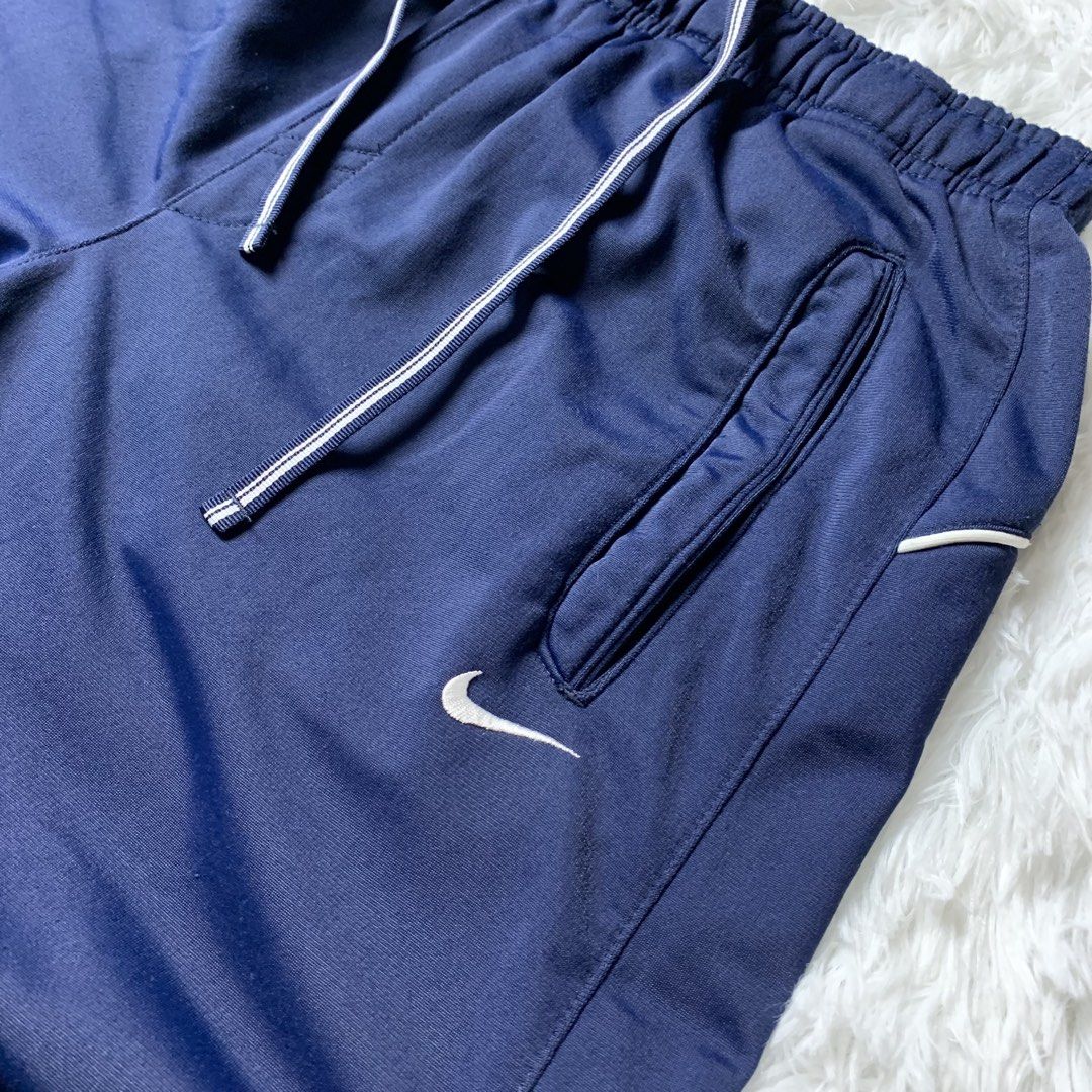 Vintage Nike Trackpants w/ Snap Pockets (Category: Joggers) located in Mandaluyong City. Submitted by ikonicpieces (Listing ID 1470725917, Image 3). Description: Dimes: W: 27” - 32” L: 41” Front Rise: 11.5” Leg Hole: 8” Size on tag: S (Fits S - M) Color rate: 9/10 Condition: 9/10 Issue: X MINE: 749 + SF 💳 PAYMENT: GCash / GoTyme 🚚 SHIPPING: J&T every Wed, Sat & Sun. Payment first before shipping. 📍 PLEASE NOTE -Thrifted item. Please manage you