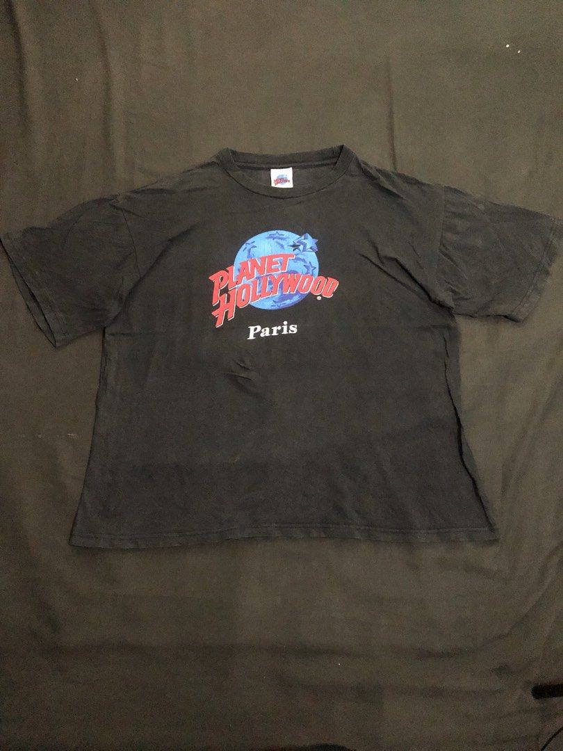 Vintage Planet Hollywood Paris Tee (Category: Tshirts & Polo Shirts ) located in Tarlac. Submitted by geegeegoods (Listing ID 1470715248, Image 2). Description: Vintage Planet Hollywood Paris Tee Size XL on tag Color Rate: 8/10 Good condition Issue: pinhole, hairline cracks and good vintage fade.