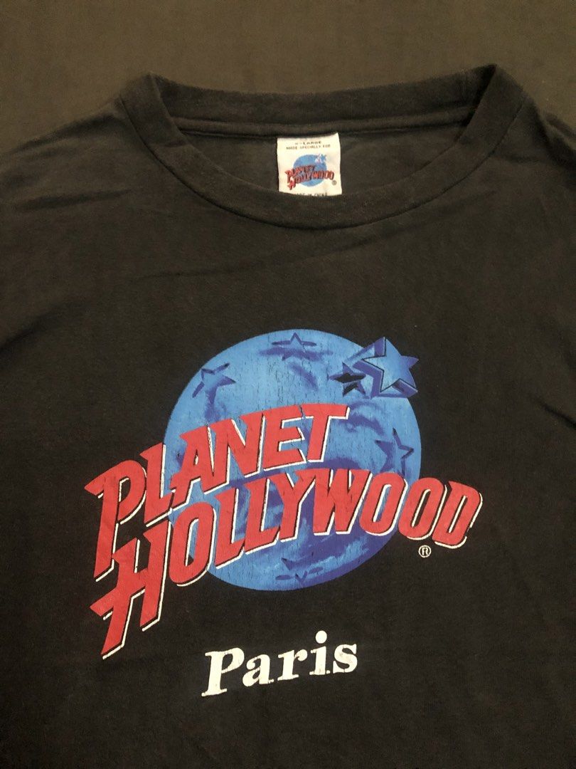 Vintage Planet Hollywood Paris Tee (Category: Tshirts & Polo Shirts ) located in Tarlac. Submitted by geegeegoods (Listing ID 1470715248, Image 1). Description: Vintage Planet Hollywood Paris Tee Size XL on tag Color Rate: 8/10 Good condition Issue: pinhole, hairline cracks and good vintage fade.
