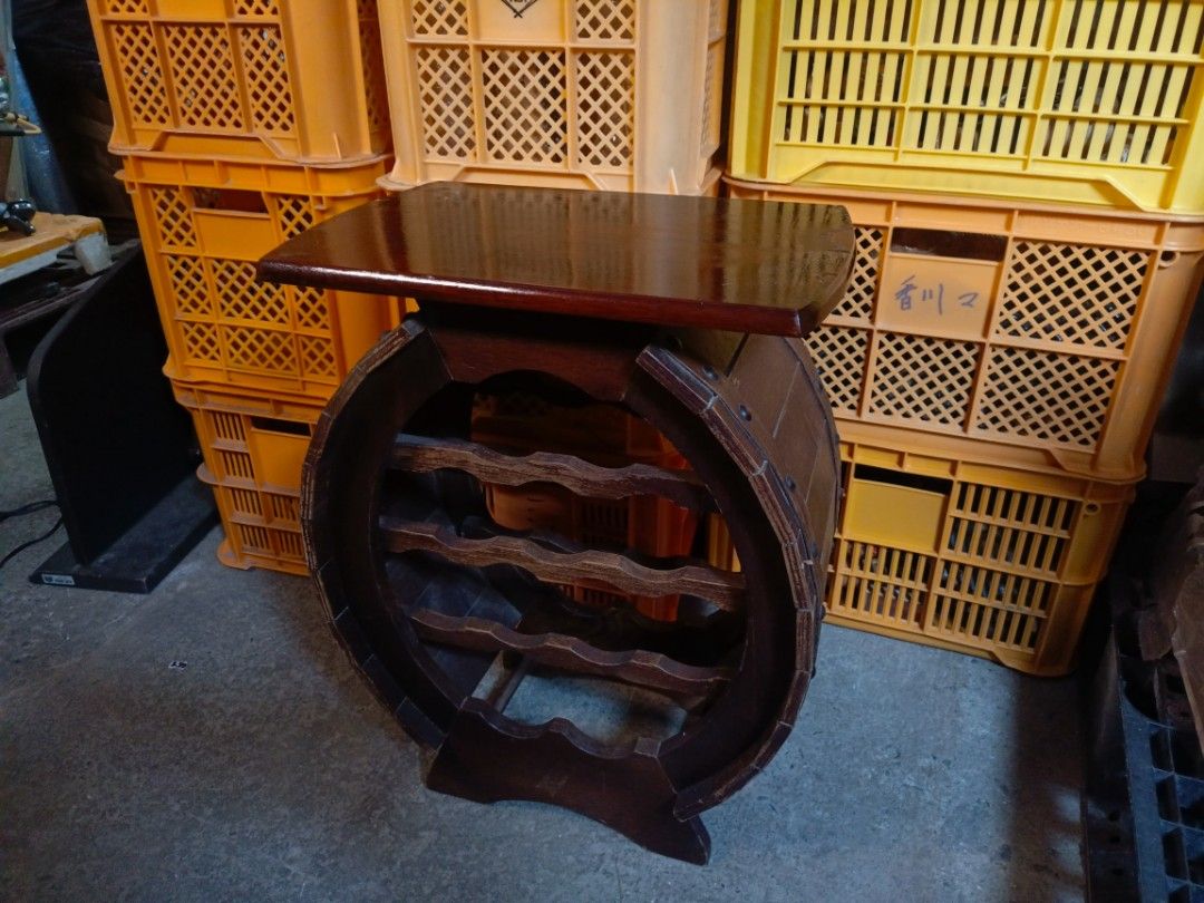 Vintage Wooden Round Barrel Wine Rack Table (Category: Tables & Sets) located in Valenzuela. Submitted by feel_lucky (Listing ID 1470653632, Image 2). Description: - Type: Round wooden wine rack with flat tabletop surface - Capacity: Holds multiple wine bottles horizontally - Design: Compact, freestanding, dark wood grain finish - Condition: Sturdy and ready to use, with minor surface scratches and edge wear on the top board - Ideal for: Small sp