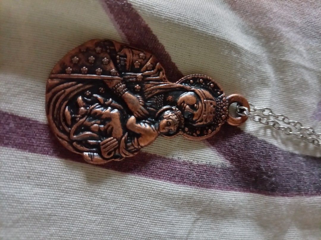 Virgin Mary and Child Copper Pendant Necklace (Category: Necklaces) located in Quezon City. Submitted by chacha30.s (Listing ID 1470651069, Image 2). Description: - Copper-tone pendant featuring the Virgin Mary and Baby Jesus - Back engraved with Romanian inscription: "PREA SFÂNTA NĂSCĂTOARE DE DUMNEZEU MILUIEŞTE-NĂ PRE MINE PĂCĂTOSUL" - Comes with a silver-tone link chain and secure lobster clasp - Lightweight metal design for comfortable everyd