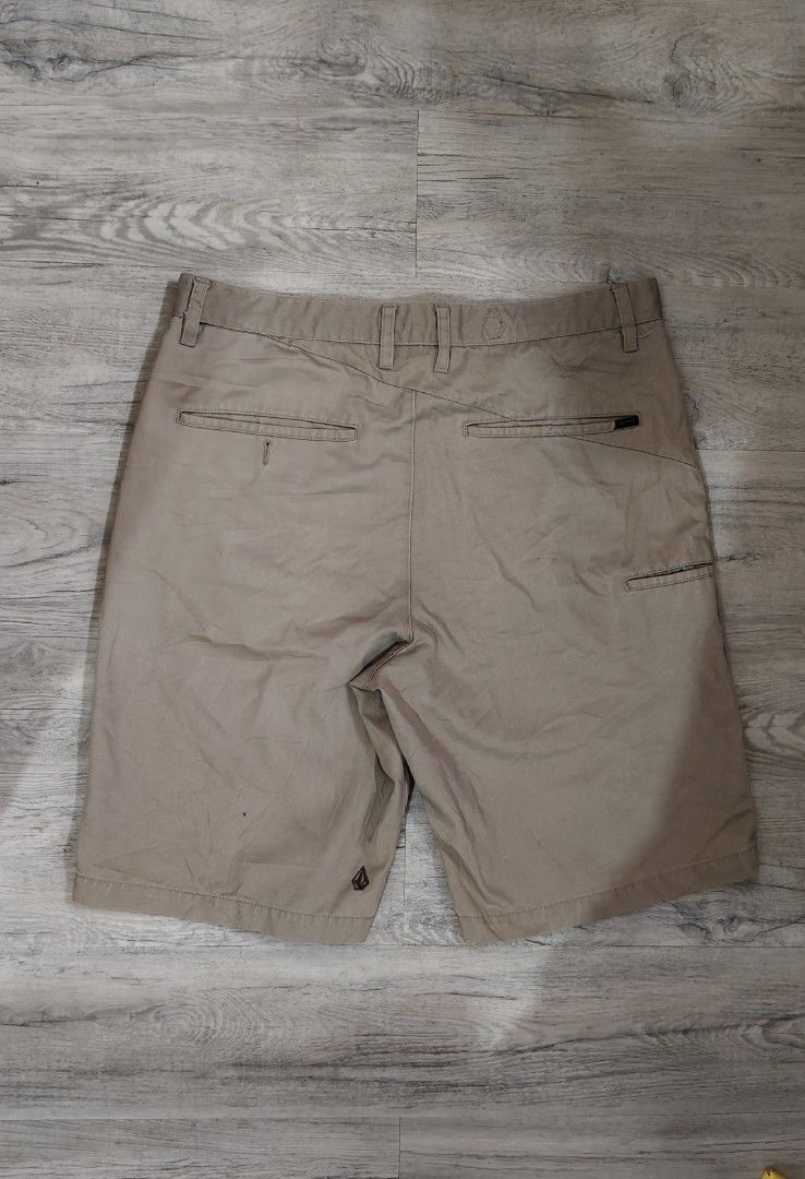 Volcom Chino Shorts Beige 34 x 22 (Category: Shorts) located in Quezon City. Submitted by truedeer_cda94c (Listing ID 1470602860, Image 2). Description: - Brand: Volcom - Style: Chino shorts - Color: Neutral beige with blue pocket lining - Details: Classic front button closure, belt loops, dual front hand pockets, dual back welt pockets - Branding: Embroidered Volcom stone logo on lower left leg and inner waistband - Condition: Great casual wear 