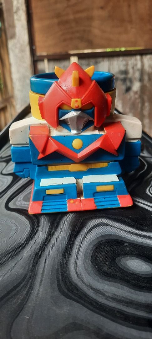 Voltez V Robot Character Molded Coffee Mug (Category: Action & Battle Toys) located in Caloocan City. Submitted by newdragon_8e420e (Listing ID 1470674054, Image 1). Description: - Official Voltron character mug featuring a 3D molded robot face - Vibrant red, blue, yellow, and white colors with a blue handle and interior - Features Voltez V embossed on the side handle area - Care instructions: Hand wash only, do not microwave (Made in China) - Co