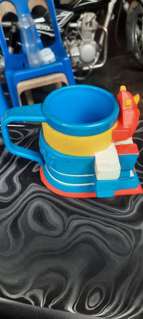 Voltez V Robot Character Molded Coffee Mug (Category: Action & Battle Toys) located in Caloocan City. Submitted by newdragon_8e420e (Listing ID 1470674054, Image 3). Description: - Official Voltron character mug featuring a 3D molded robot face - Vibrant red, blue, yellow, and white colors with a blue handle and interior - Features Voltez V embossed on the side handle area - Care instructions: Hand wash only, do not microwave (Made in China) - Co