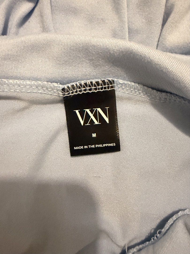 VXN Light Blue Draped Tube Top Size M (Category: Sleeveless) located in Paranaque City. Submitted by __saintlike (Listing ID 1470577109, Image 2). Description: - Brand: VXN - Color: Light blue - Size: Medium - Style: Strapless tube top with draped cowl front - Material: Soft and stretchy fabric - Fit: Easy pull-on style - Origin: Made in the Philippines.