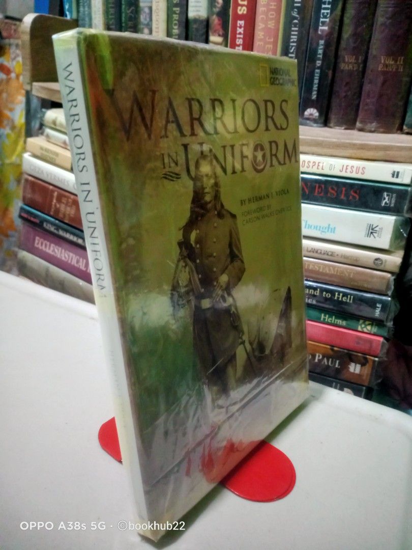 WARRIORS IN UNIFORM by HERMAN J. VIOLA (Category: Storybooks) located in Rizal. Submitted by bookhub22 (Listing ID 1470666248, Image 3). Description: Published by National Geographic, this illustrated history explores the extensive and deeply rooted tradition of Native Americans serving in the United States military. Despite historical conflicts with the U.S. government, Native Americans enlist at a higher percentage relative to their population 