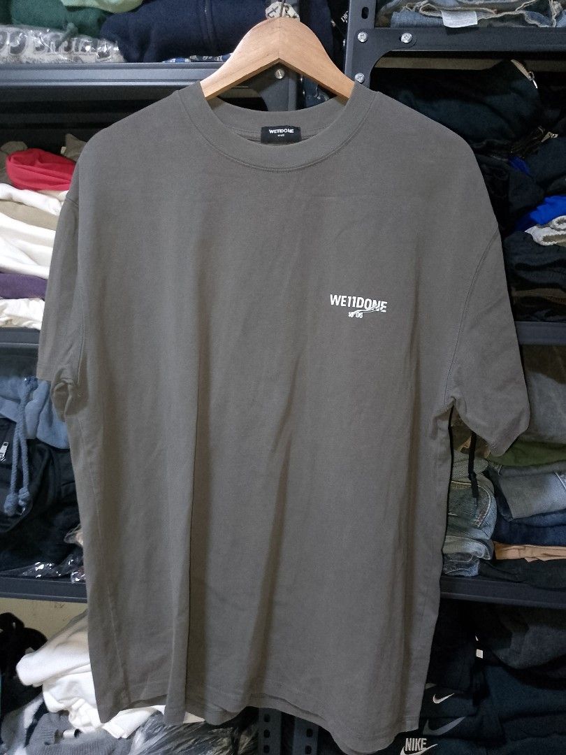 We11done Grey Graphic Tee Size L (Category: Tshirts & Polo Shirts ) located in Manila. Submitted by mjthrifted_second (Listing ID 1470611612, Image 1). Description: - Brand: We11done - Color: Grey - Size: Large -Dimes: 23/29 - Material: 100% cotton - Design: Graphic print on front chest and large logo on back - Fit: Relaxed fit style - Condition: Clean condition overall, perfect for casual everyday wear.