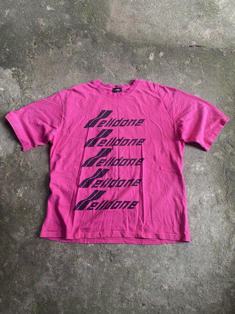 We11done Pink Repeated Logo T-Shirt (Category: Shirts) located in Caloocan City. Submitted by remythrift (Listing ID 1470589590, Image 1). Description: - Brand: We11done - Color: Bright pink with stacked black logo print - Size: Tagged M (oversized, fits like one-size) - Material: Cotton and polyester blend (Made in Korea) - Condition: Light wear from normal washing.